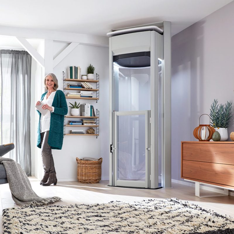 Women Smiling with home lift in her office